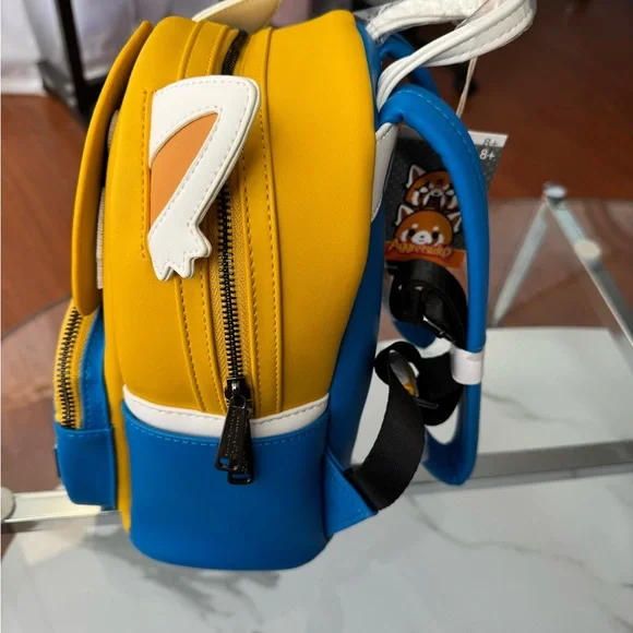 aggretsuko mini backpack Loungefly Sanrio Two Face Backpack, Two Face After five years at the same company Sanrio Aggretsuko Angry Face Mini